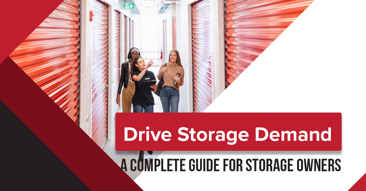 Three women walking through a brightly lit self-storage facility with rows of red storage doors, discussing strategies for increasing storage demand. The graphic includes bold text reading 'Drive Storage Demand: A Complete Guide for Storage Owners.