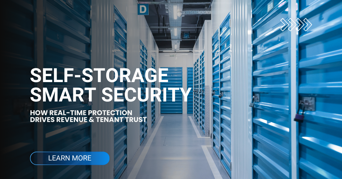 Interior of a brightly lit self-storage facility with blue roll-up doors, overlaid text reading “Self-Storage Smart Security – How Real-Time Protection Drives Revenue & Tenant Trust” and a blue ‘Learn More’ call-to-action button.